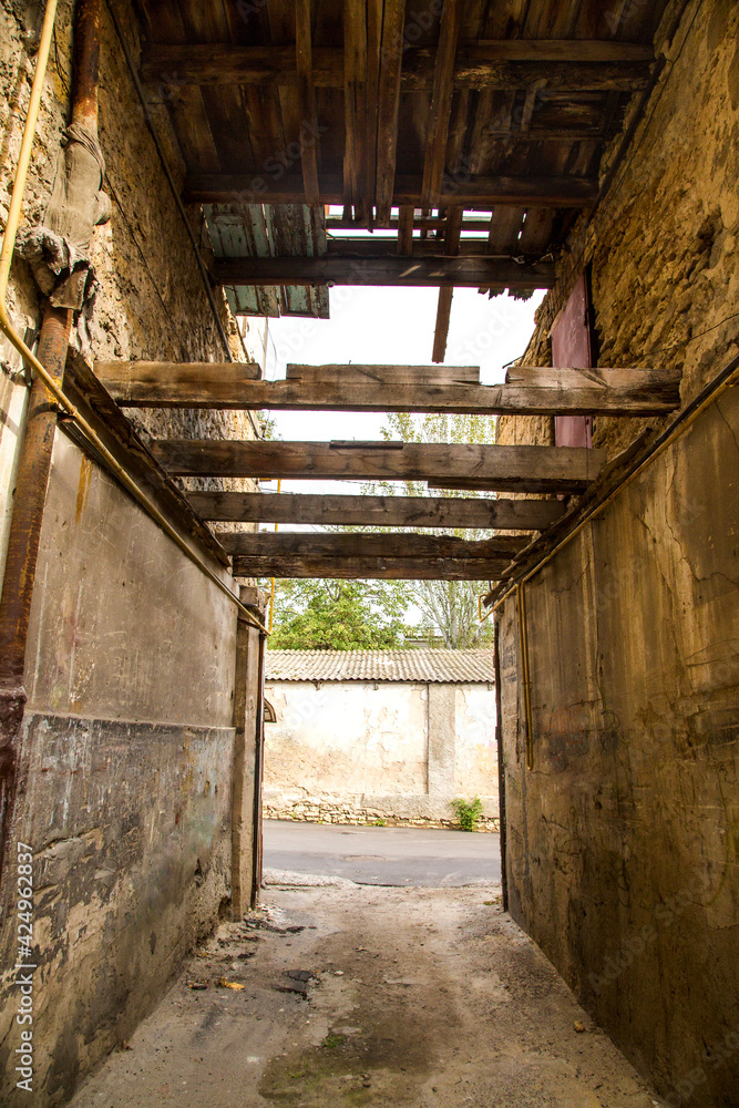  passage between old dilapidated houses