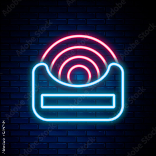 Glowing neon line Dental floss icon isolated on brick wall background. Colorful outline concept. Vector