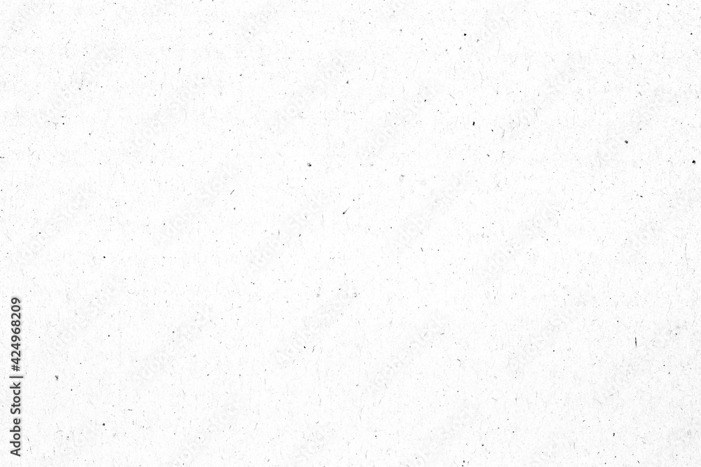 Naklejka premium White paper or cardboard texture with black spot background.