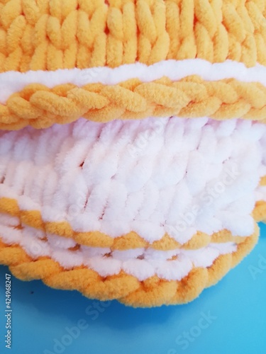 hand-knitted yellow and white plaid, chunky knitting, close-up