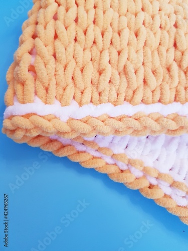 hand-knitted yellow and white plaid, chunky knitting, close-up