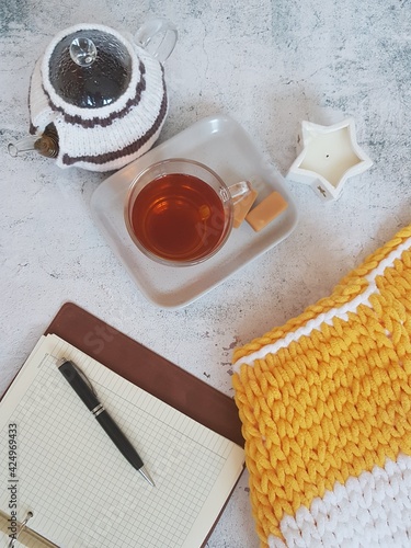 tea drinking, cup and teapot with tea on gray background