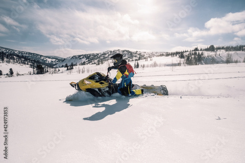  Rider on snowmobile in beautiful landscape