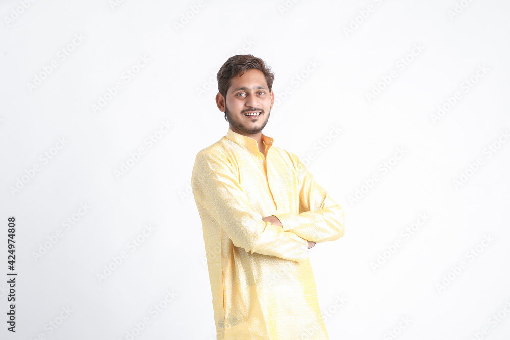 Young indian man in tradition wear and standing on white background. Young indian man in tradition wear and standing on white background.