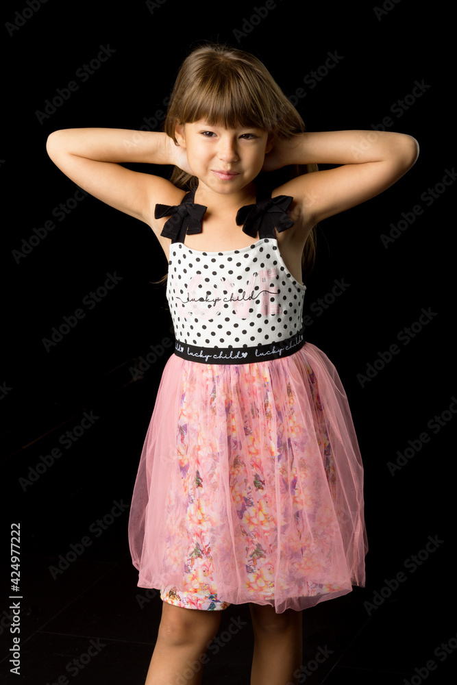 Portrait of cheerful girl in summer clothes