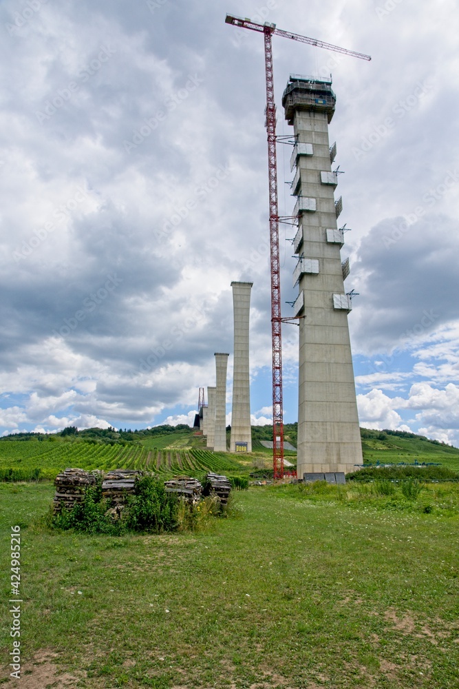 Zeltingen-Rachtig Germany - 30 July 2015 - Building the bridge over Mosel River (Hochmoselbrücke on E42 highway) in Germany Zeltingen-Rachtig Germany - 30 July 2015 - Building the bridge over Mosel River (Hochmoselbrücke on E42 highway) in Germany