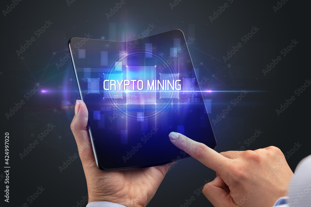 Businessman holding a foldable smartphone Businessman holding a foldable smartphone