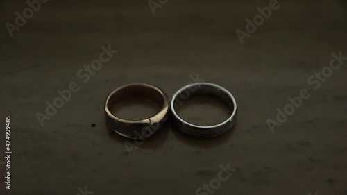 The wedding ring is gold and silver in color, exuding an intrinsic beauty