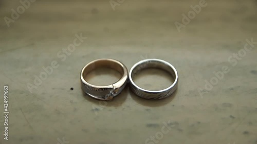 The wedding ring is gold and silver in color, exuding an intrinsic beauty