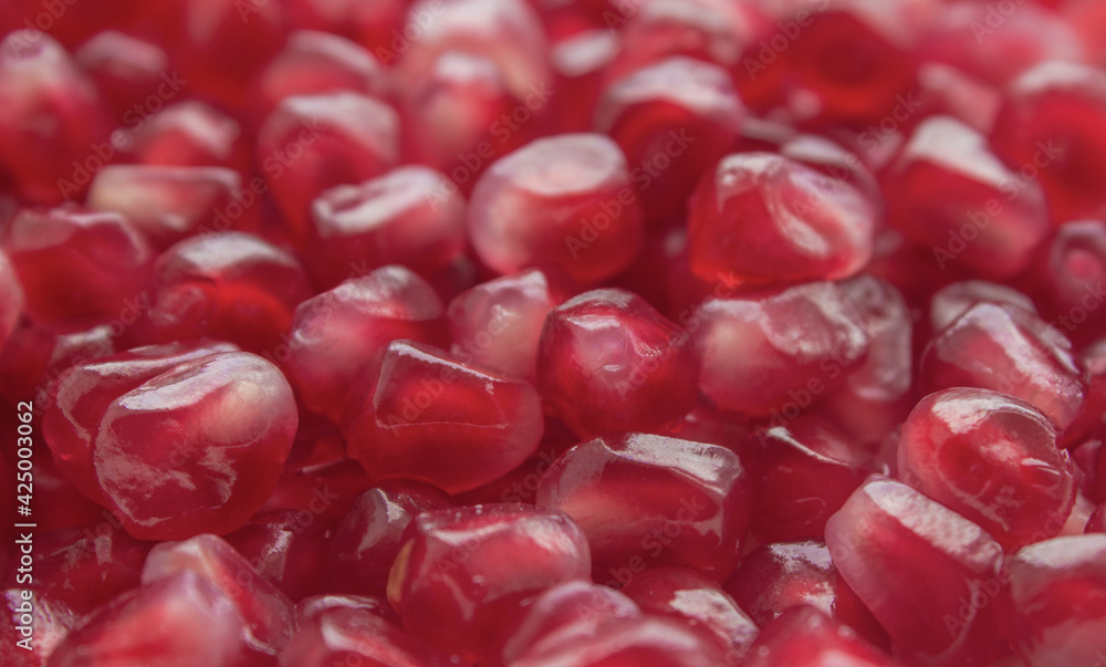 Pomegranate background. Red pomegranate seeds. Pomegranate background. Red pomegranate seeds.