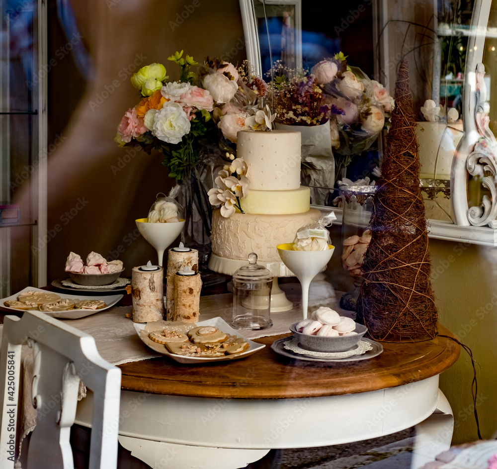 Beautifully decorated cakes on display at a bakery shop Beautifully decorated cakes on display at a bakery shop