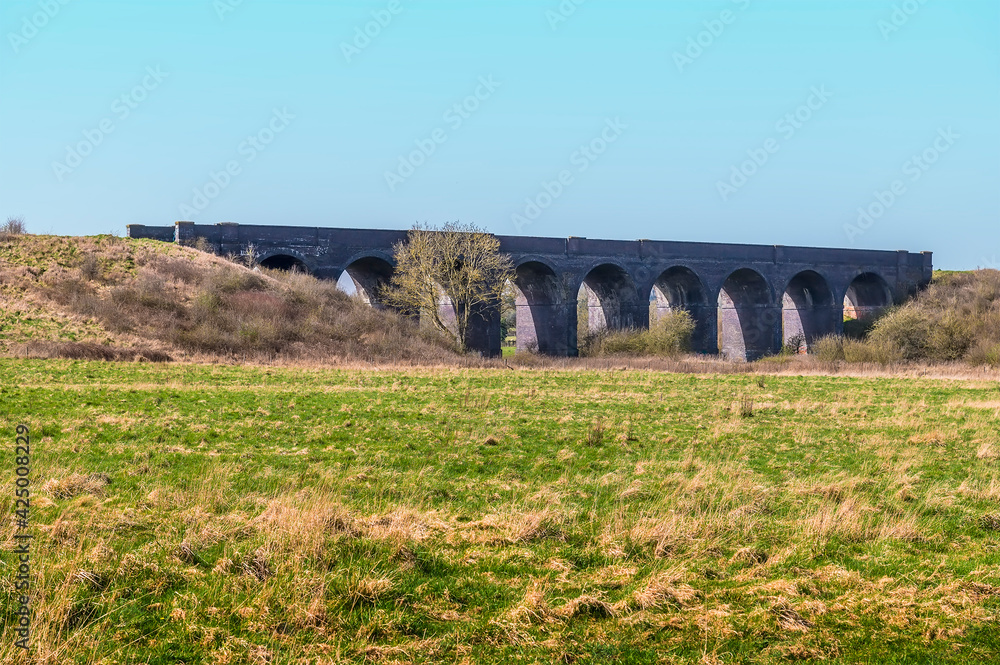 A view from the village of Helmdon toward the abandoned Helmdon viaduct on a bright Spring day