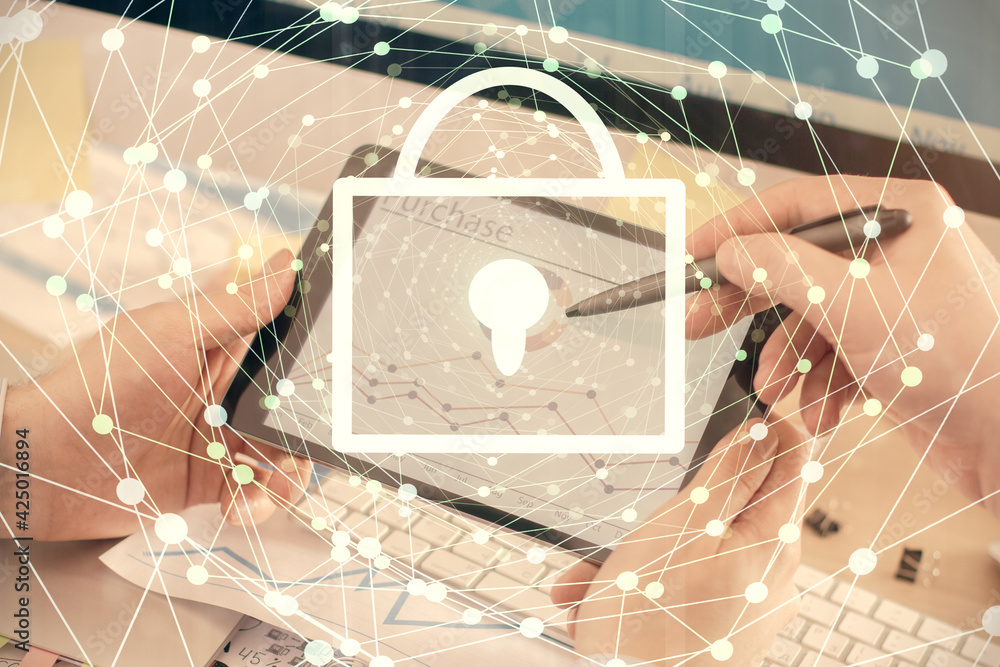Multi exposure of man's hands holding and using a digital device and lock drawing. Security concept. Multi exposure of man's hands holding and using a digital device and lock drawing. Security concept.