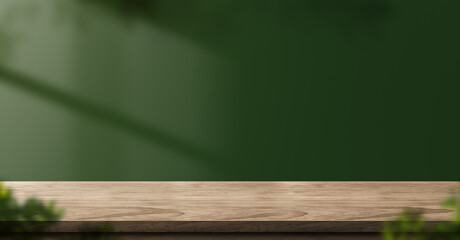 wood table green wall background with sunlight window create leaf shadow on wall with blur indoor green plant foreground.panoramic banner mockup for display of product.eco friendly interior concept
