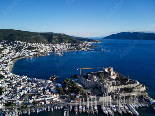 Amazing panoramic view from drone of beautiful full of yachts Bodrum harbour and ancient Kalesi castle in Mugla province in Turkey 