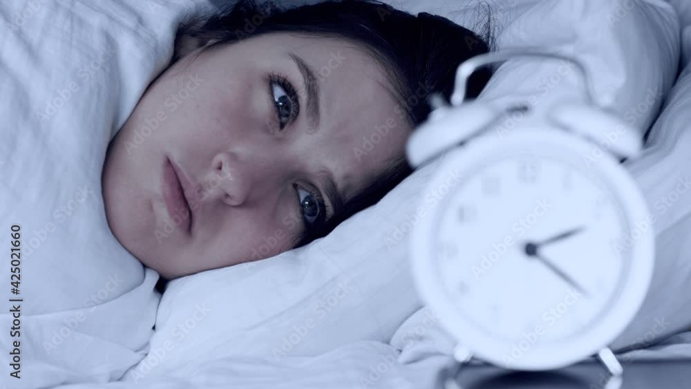 Stockvideon Insomnia, anxiety, stress. Face of sleepy woman at night