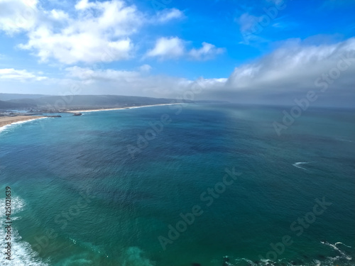 Wonderful aerial view of beach and waves at Nazare in Portugal