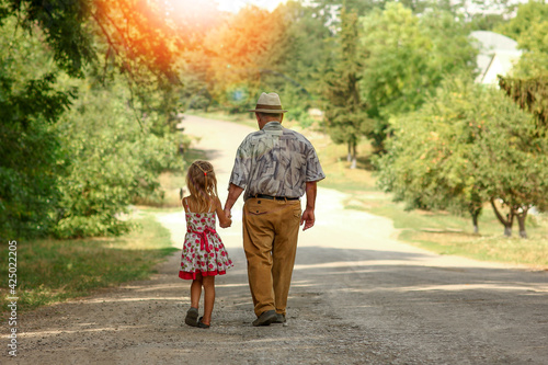 grandfather with the granddaughter go on the road