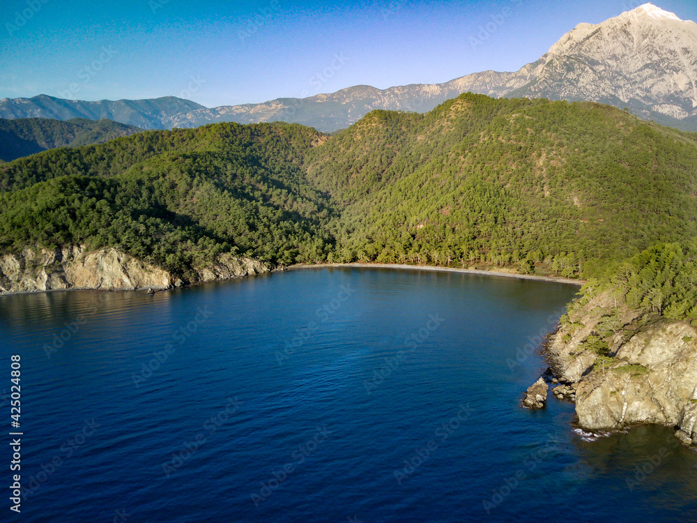 Amazing beautiful panoramic view from drone of natural park of Oludeniz and Fethiye blue lagoon and tranquil aquamarine dead sea.
