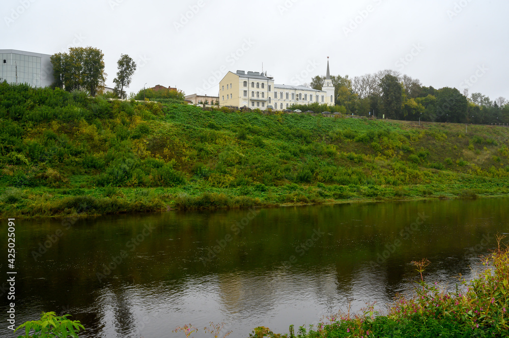 View of the Volga River and the building of the former State Bank, Rzhev, Tver region, Russian Federation, September 19, 2020