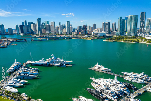aerial drone view of boats with downtown Miami skyline in the back © Cristian