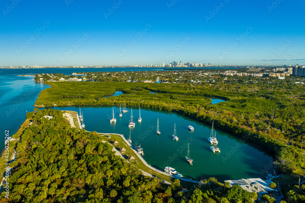 aerial drone view of boats in Key Biscayne with downtown Miami skyline in the back