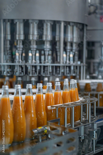 Juice factory, product line, peach juice bottle on the product line