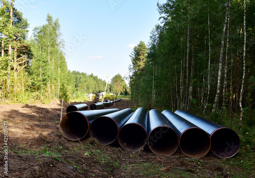 Pipes for natural gas pipeline project. Oil and gas pipelines. Fuel and energy concept. Oil pipeline that would carry tar sands for oil refineries. Fossil fuels and crude