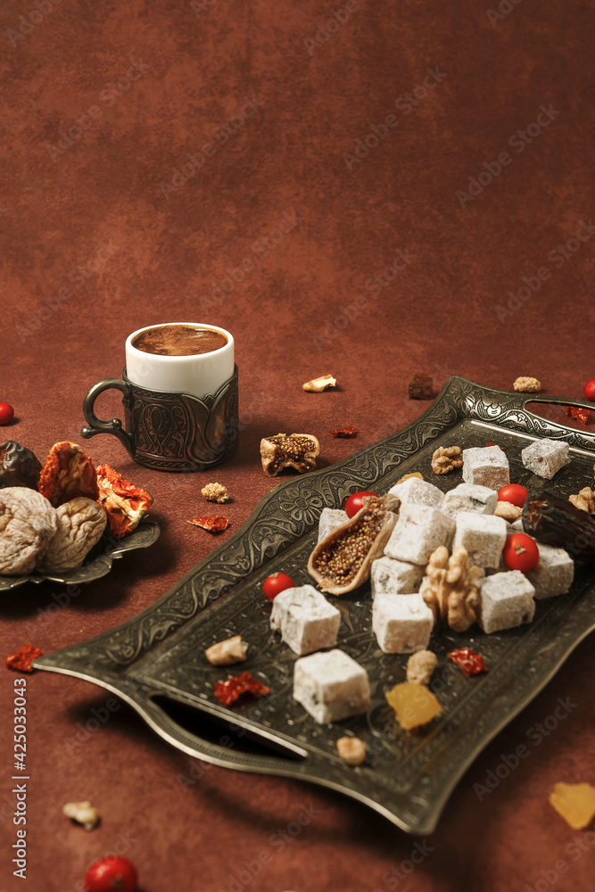 Turkish delight arranged with dried fruits, flower