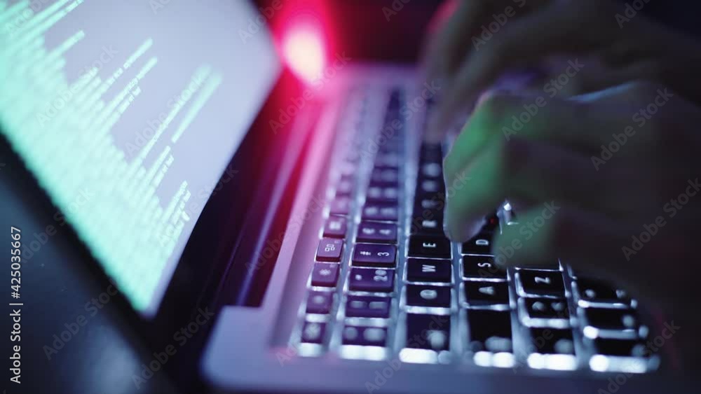 Computer hacker typing on keyboard Computer hacker typing on keyboard