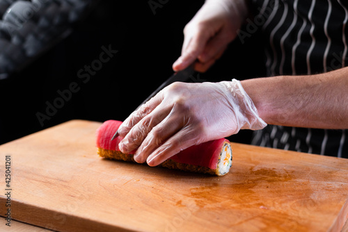 sushi with salmon and knife