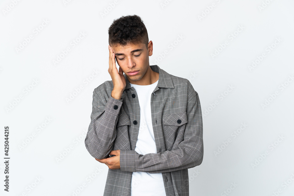 Young brazilian man isolated on white background with headache Young brazilian man isolated on white background with headache