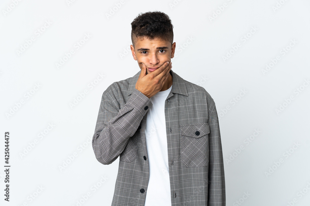 Young brazilian man isolated on white background having doubts Young brazilian man isolated on white background having doubts