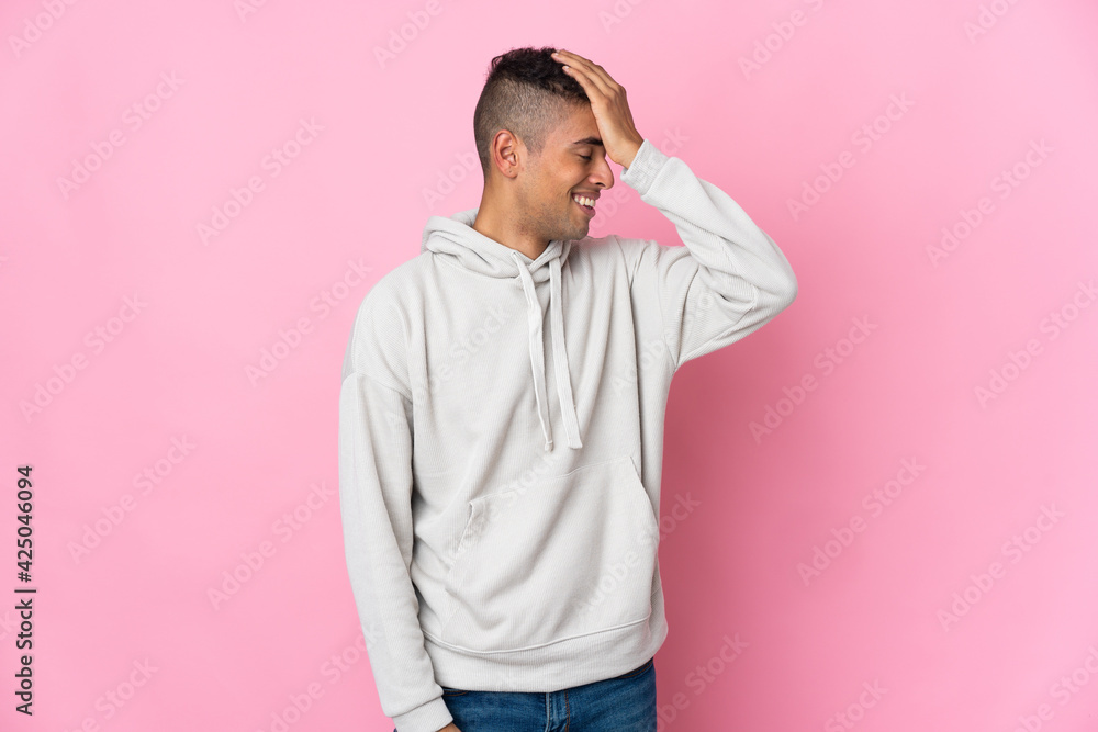 Young Brazilian man isolated on pink background has realized something and intending the solution Young Brazilian man isolated on pink background has realized something and intending the solution