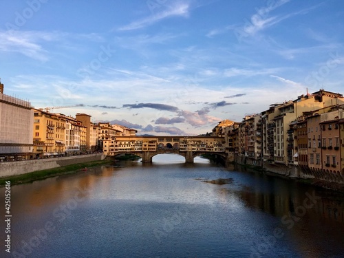 Sunset with the golden bridge view in Florence. Italy. Ponte Vecchio. Famous sightseeing in Firenze. Arno river.