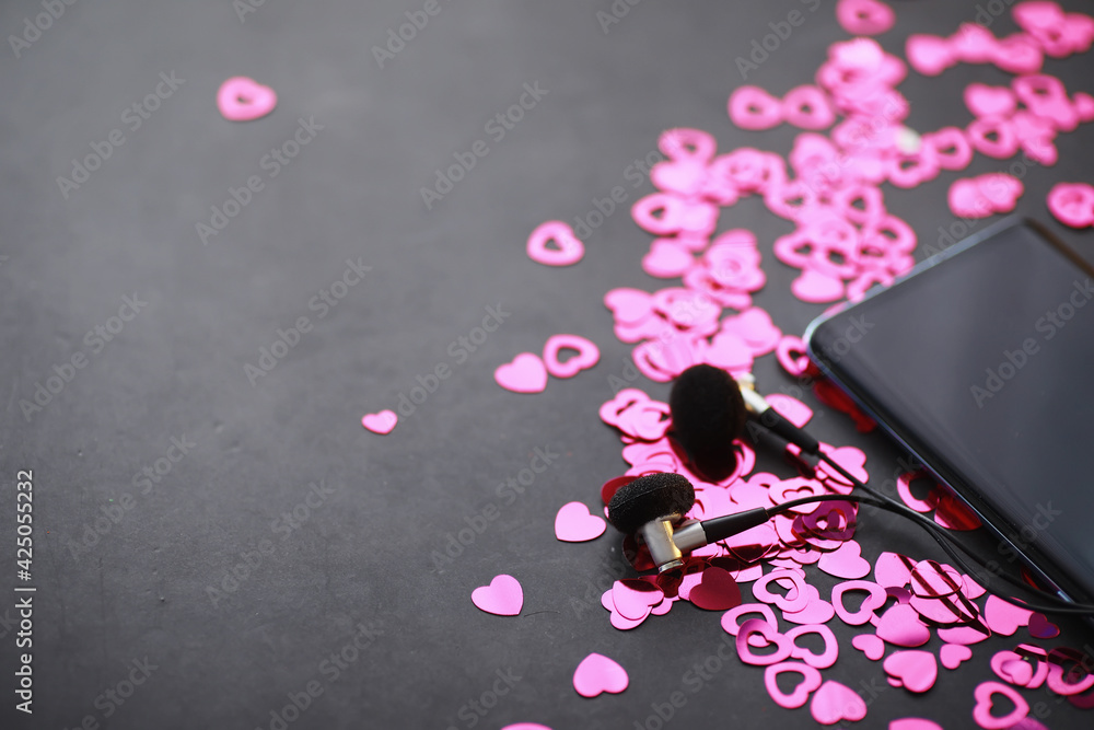 Romantic background. The concept of love and relationships. Heart shaped figures on a dark background. Card for Valentine's Day. Romantic background. The concept of love and relationships. Heart shaped figures on a dark background. Card for Valentine's Day.