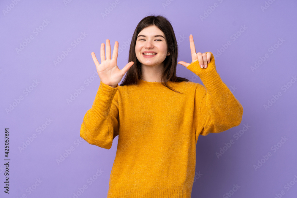 Young Ukrainian teenager girl over isolated purple background counting seven with fingers Young Ukrainian teenager girl over isolated purple background counting seven with fingers