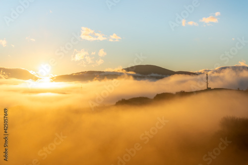 sunrise over the mountains and fields