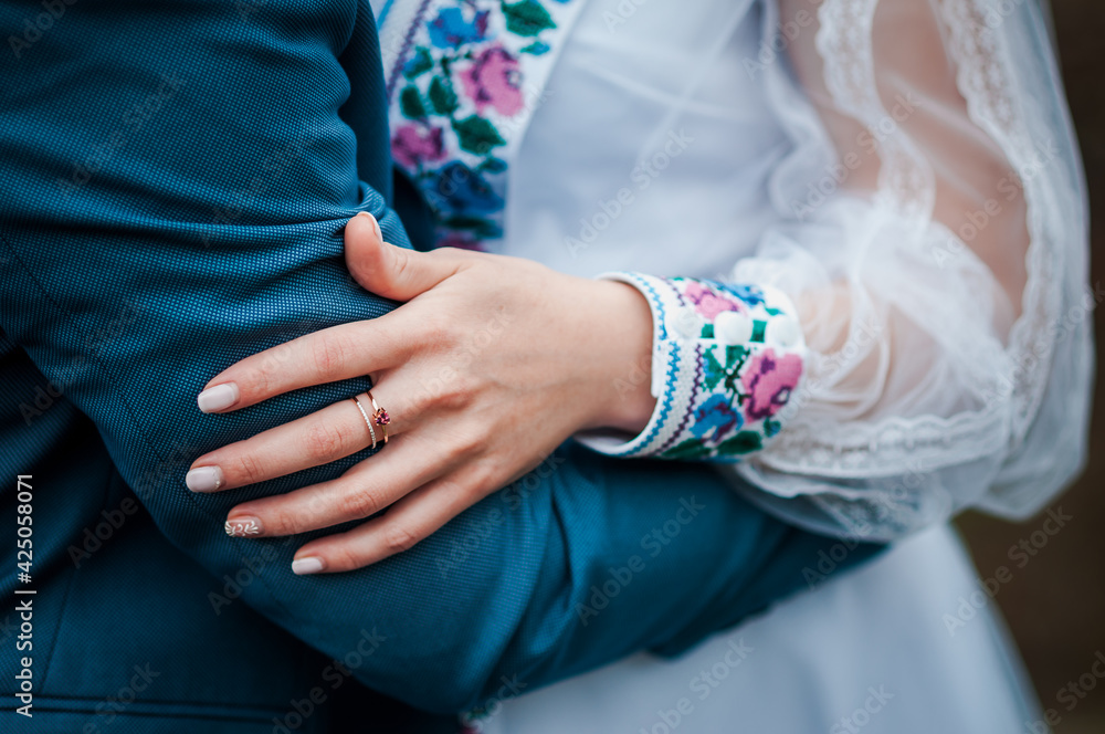The bride is holding the groom's hand The bride is holding the groom's hand