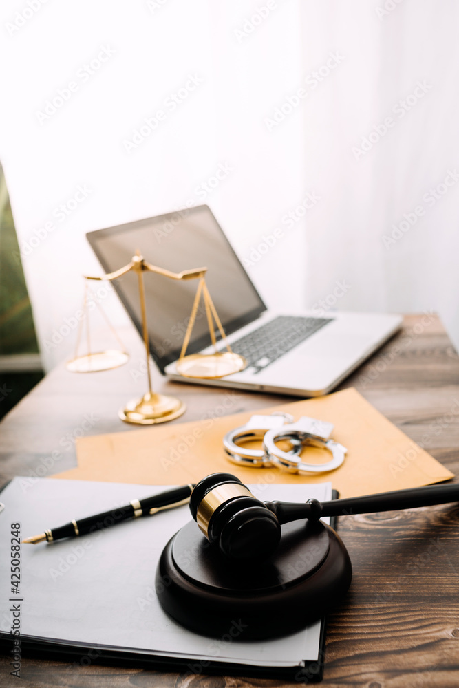 justice and law concept.Male judge in a courtroom on wooden table and Counselor or Male lawyer working in office. Legal law, advice and justice concept. justice and law concept.Male judge in a courtroom on wooden table and Counselor or Male lawyer working in office. Legal law, advice and justice concept.