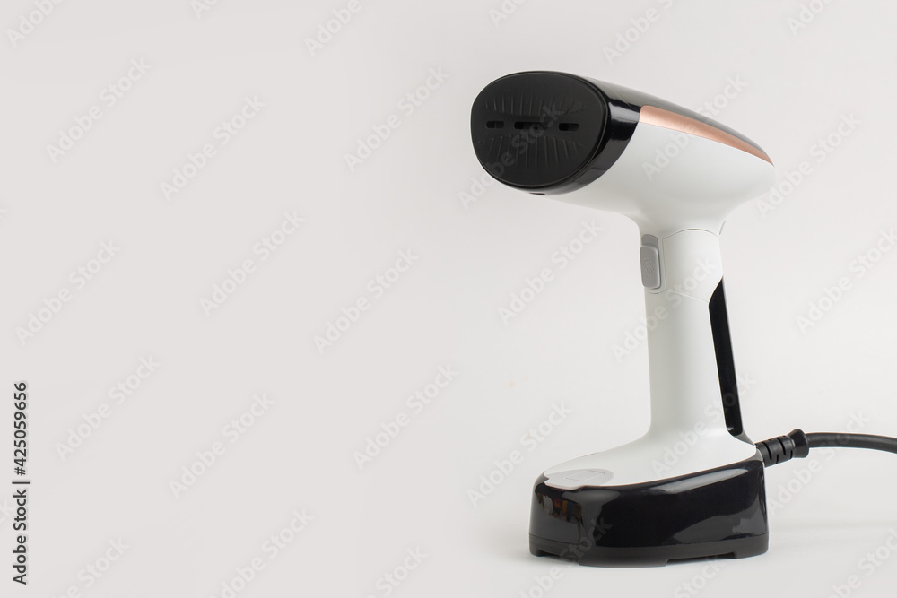 Steamer iron in studio on white background Steamer iron in studio on white background