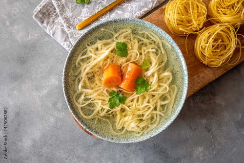 Photos Turkey and beef broth with noodles in a bowl
