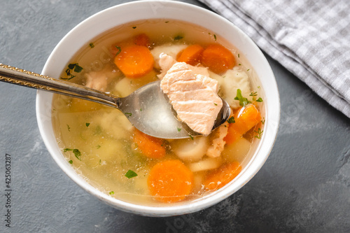 Billede på lærred Fish soup with pieces of salmon and cod with vegetables