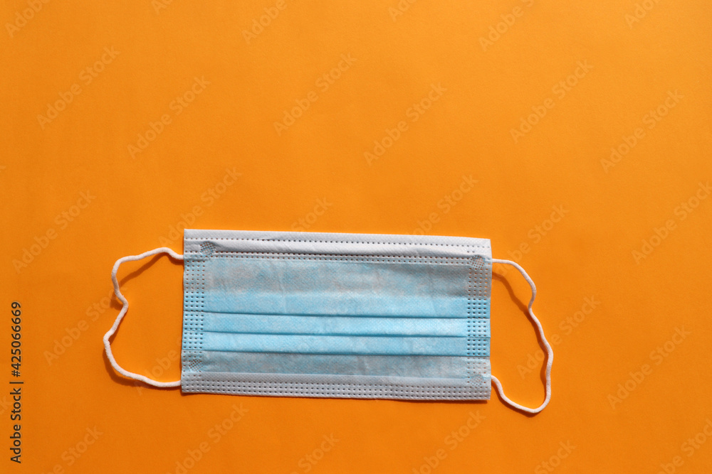 Stack of blue medical hygienic mask on colored backdrop. Protective pandemic face masks on yellow background. Pile of disposable surgical face mask against coronavirus, covid-19. Top view, copy space
Stack of blue medical hygienic mask on colored backdrop. Protective pandemic face masks on yellow background. Pile of disposable surgical face mask against coronavirus, covid-19. Top view, copy space