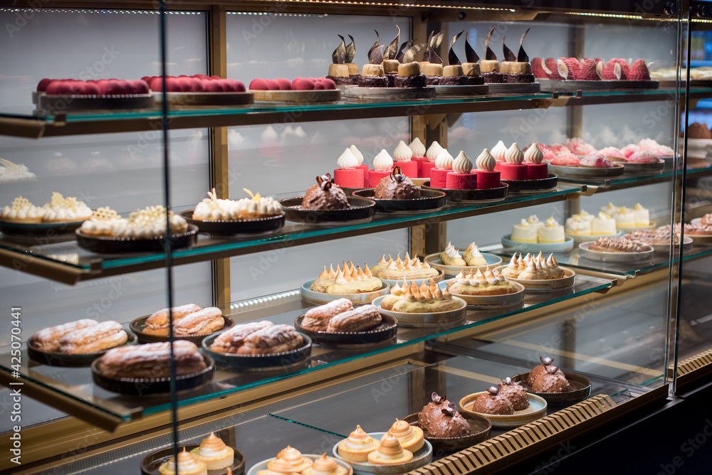 Fotografie Sweet different desserts on the shopwindow