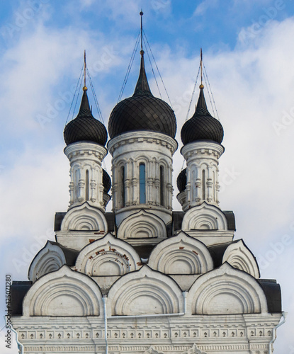 Annunciation church in Tayninskoe, Mytischi, Moscow region, Russia. Spring, cloudy sky. Traditional russian orthodox church. Domes and crosses