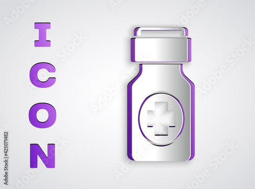 Paper cut Medicine bottle and pills icon isolated on grey background. Bottle pill sign. Pharmacy design. Paper art style. Vector