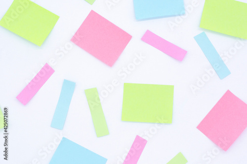multicolored blank paper stickers of different colors on a white background © Alena