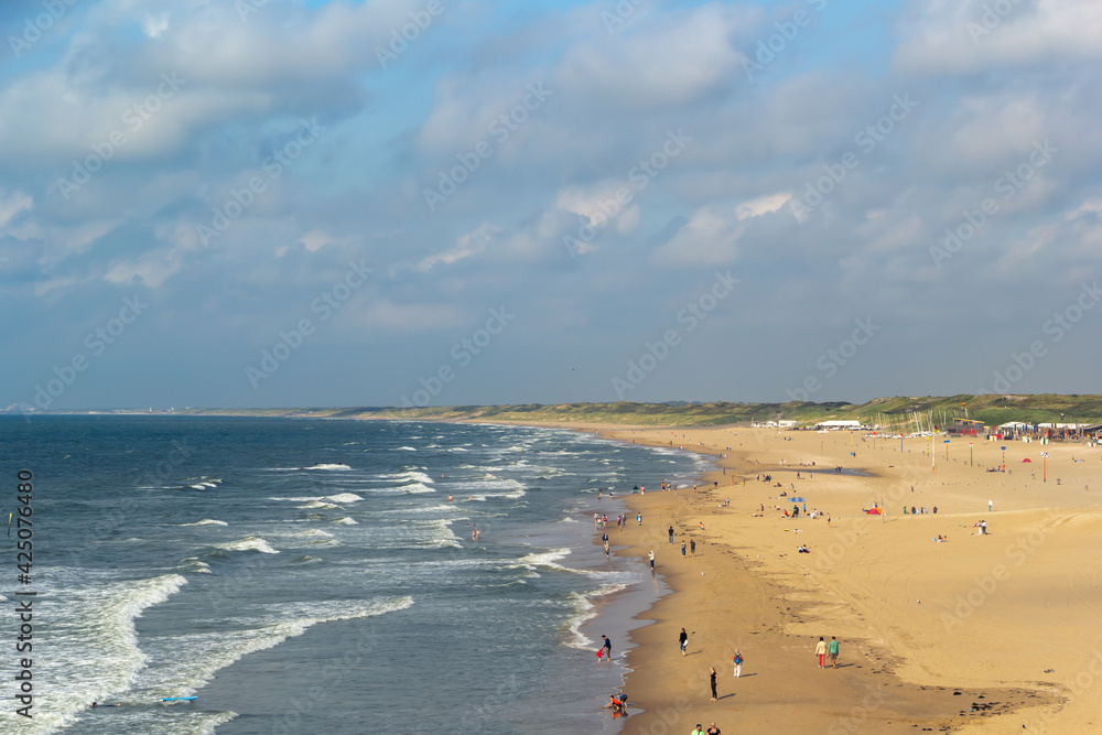 Wavy ocean beach with cloudy skies in summer Wavy ocean beach with cloudy skies in summer
