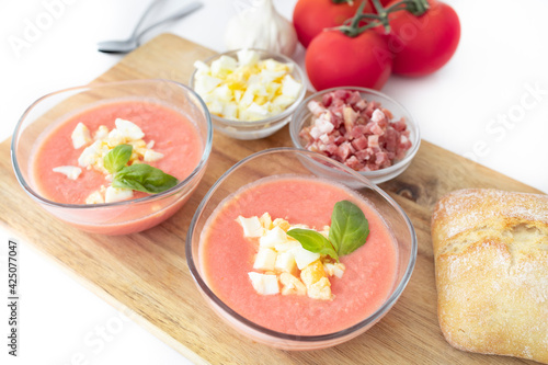 Salmorejo, cold tomato soup typical of Spanish cuisine. Tomato soup with boiled egg and Serrano ham, typical of Andalusian cuisine. Food photography